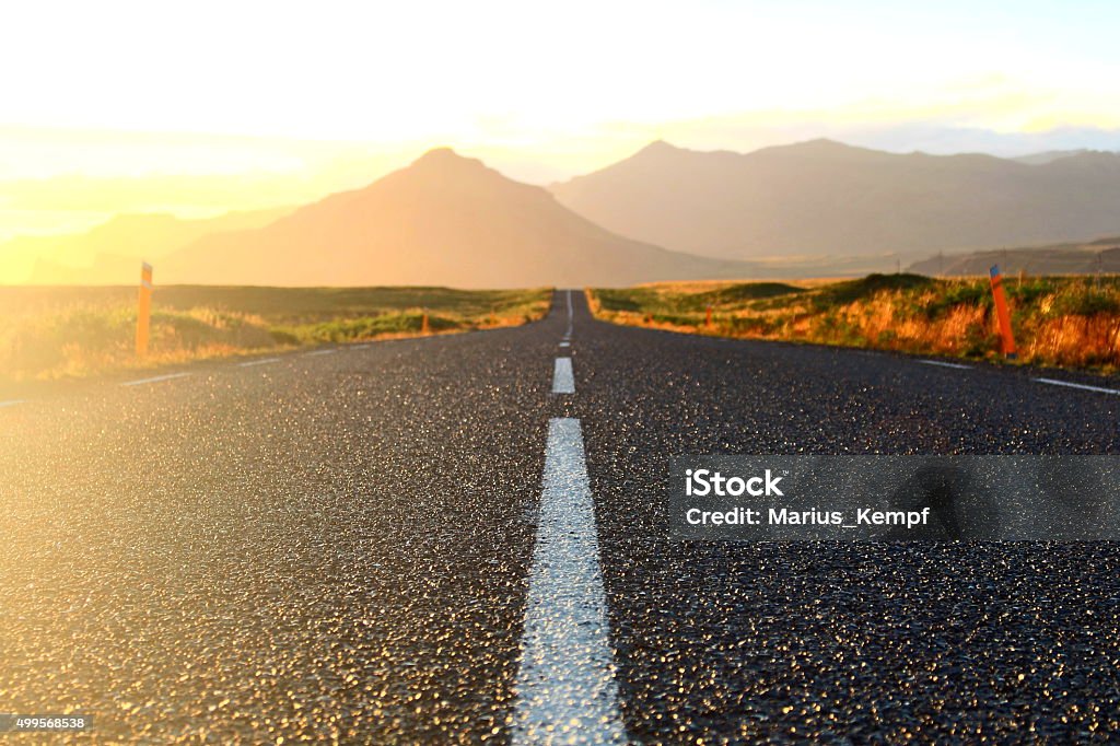 Road in the Icelandic evening sun An atmospheric picture of the Icelandic ringroad - sun-drenched and colour-intensive. Road Trip Stock Photo