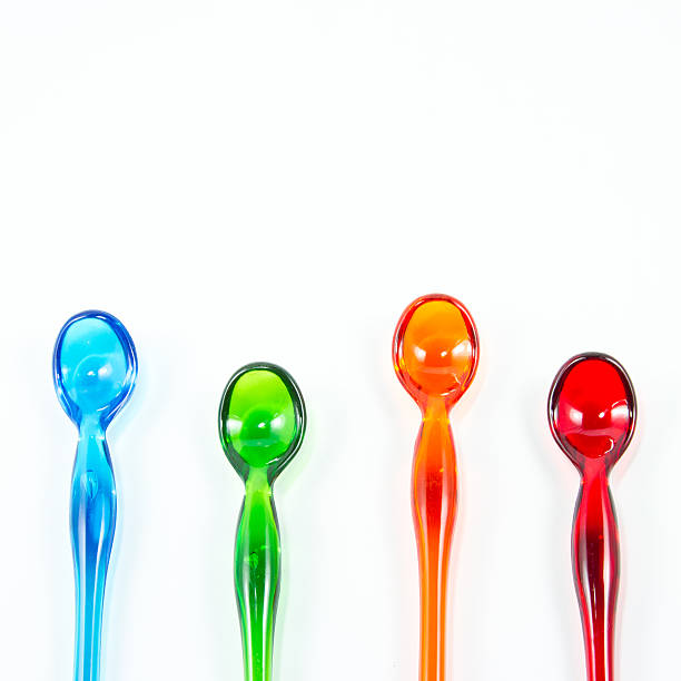 istock Color spoons isolated on white background 499568981