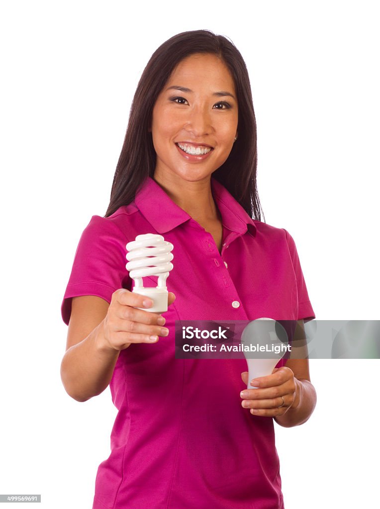 Energy Efficiency Woman CFL Lightbulb Shot in Moreno Valley, California in August of 2013. 30-39 Years Stock Photo