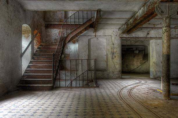 istock Old staircase in an abandoned hall 499570197