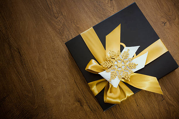 Box with candies and golden tape