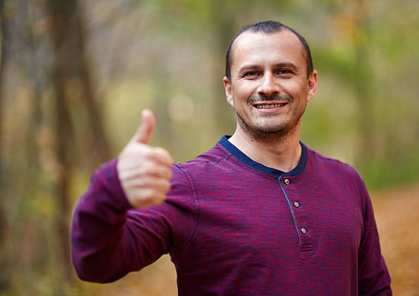 istock Thumbs up sign outdoor 499571084