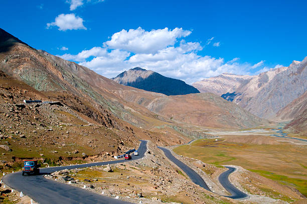 istock Desert Road with horizon blue sky and white clouds 499571349