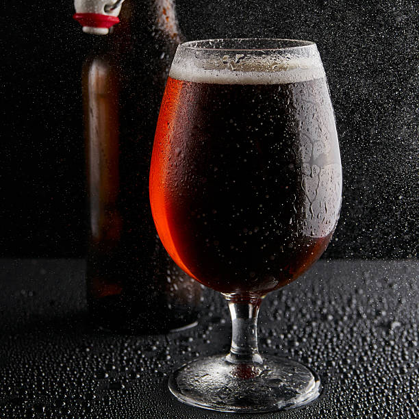 istock Beer in glass on a black background 499571438