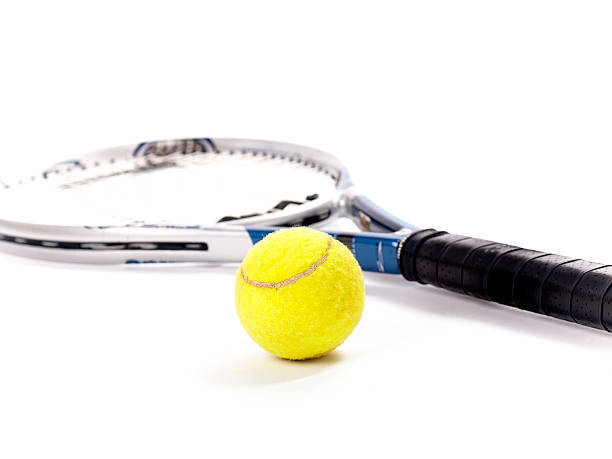 istock Yellow tennis ball and racket isolated on a white background 499571815