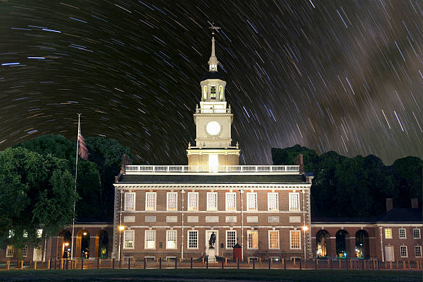 Independence Hall Star Trails Independence Hall night with star rotations. independence hall stock pictures, royalty-free photos & images