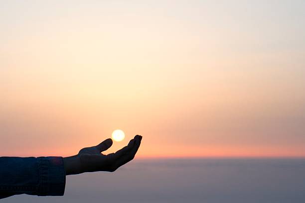 istock the sun in your hand 499574480