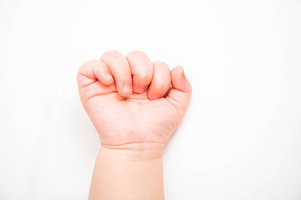 istock Six month old baby's hand on a white background 499578032