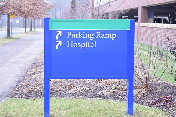 Hospital Parking This Way Blue Sign