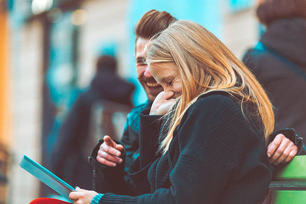 istock Young adult using digital tablet in the street 499578518