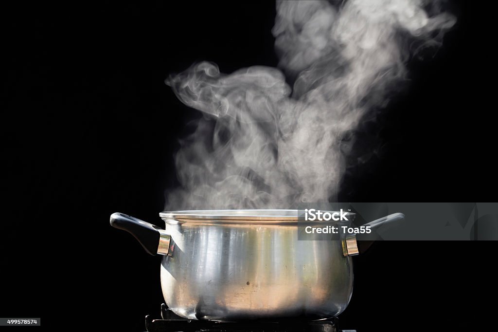 steam over cooking pot Cooking Pan Stock Photo