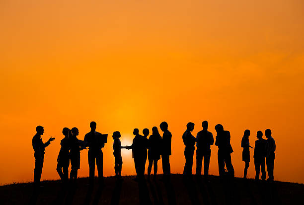 istock Business People Working Outdoors With A View Of Sunset 499578885