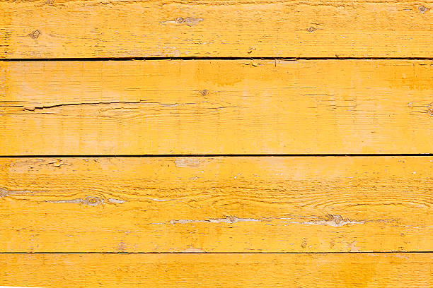 istock old planks with bright yellow paint 499579173