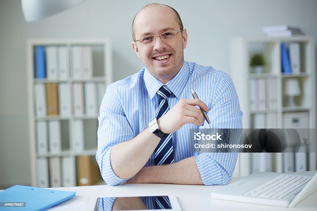 Businessman at workplace Handsome businessman working in office Adult Stock Photo