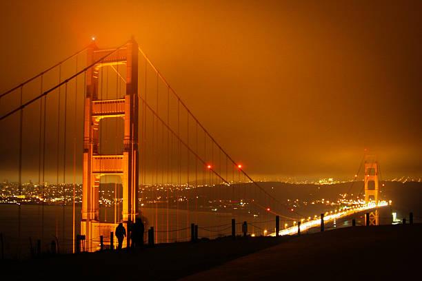 Golden Gate bridge on a cloudy, windy night. stock photo