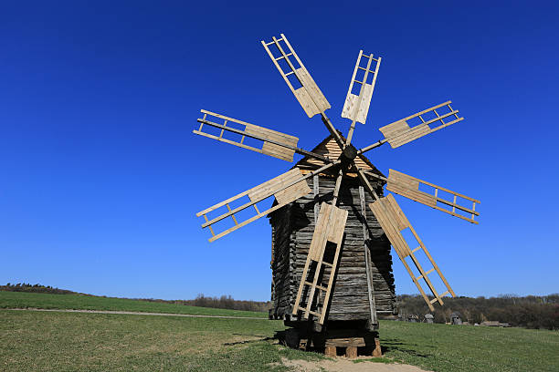 istock old wooden windmill on meadow 499581215
