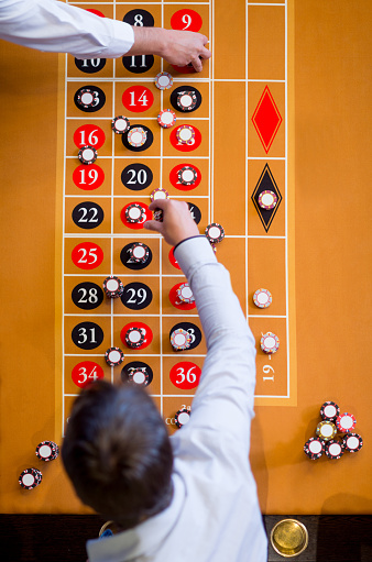 People betting at the Roulette in the Casino