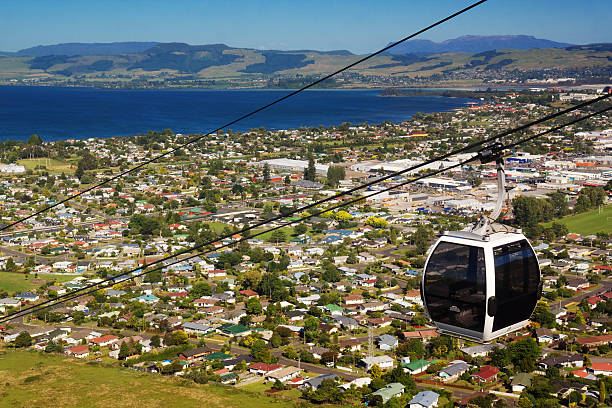 Skyline Rotorua A cable car heads above the town of Rotorua, New Zealand. rotorua stock pictures, royalty-free photos & images
