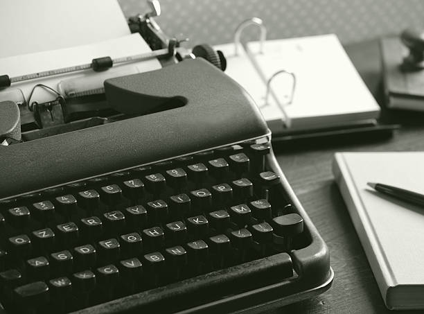 istock Old typewriter on a wooden desk 499585709