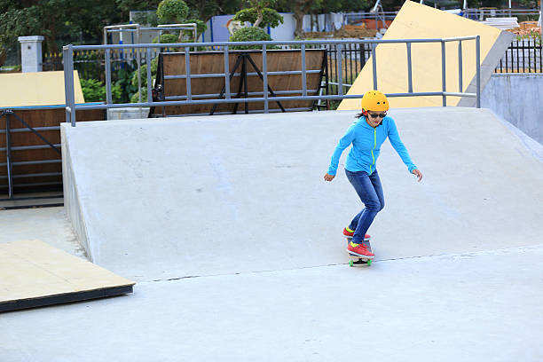 istock skateboarding woman at skatepark 499594600
