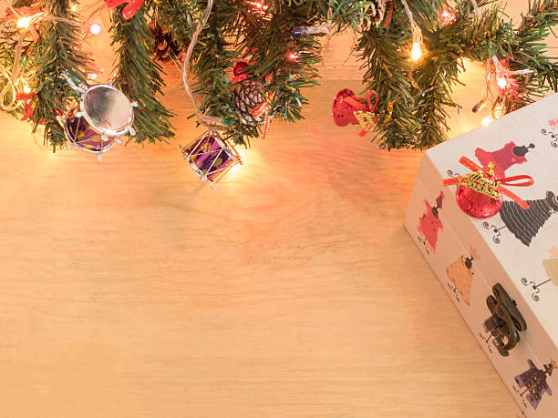 istock gift present with christmas tree on wooden background 499595354
