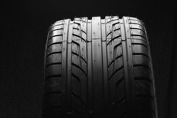 istock Profile of a new car tire on  black background 499597079