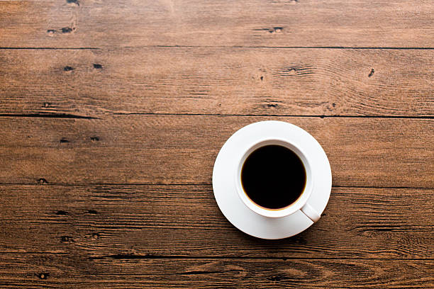 istock Coffee cup on the wooden table 499598062