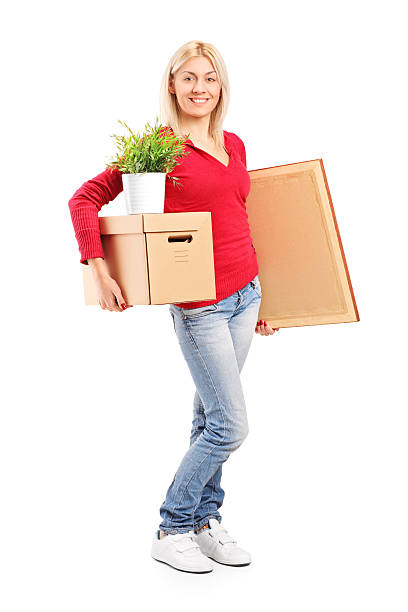istock Girl holding a moving box and painting 499598121