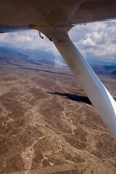 istock Flight over Nazca Lines: Canyon and Mountains 499598126