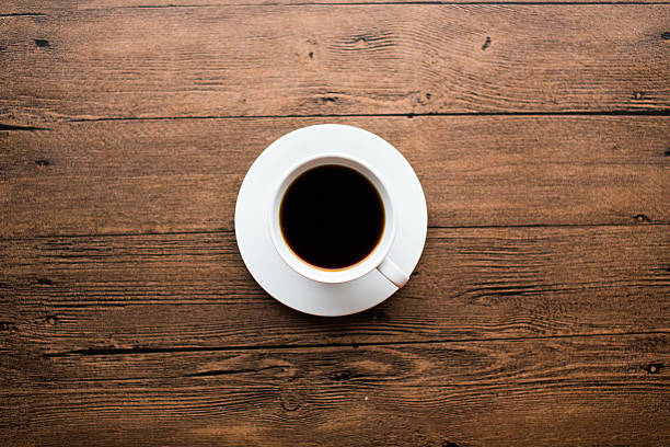 istock Coffee cup on the wooden table 499598332