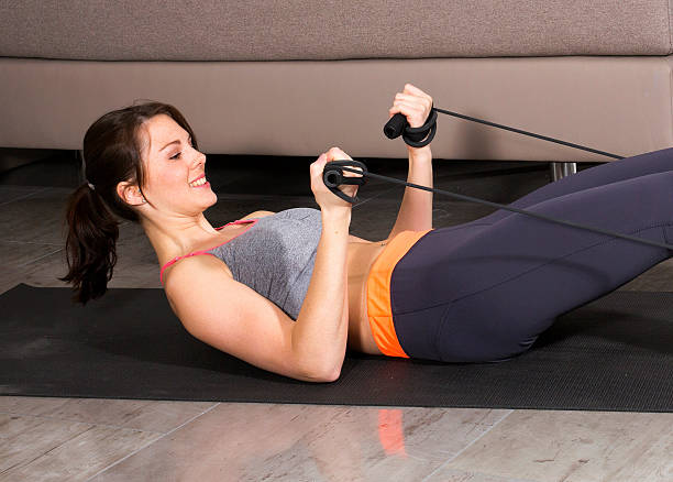 istock Woman exercising at home 499599477