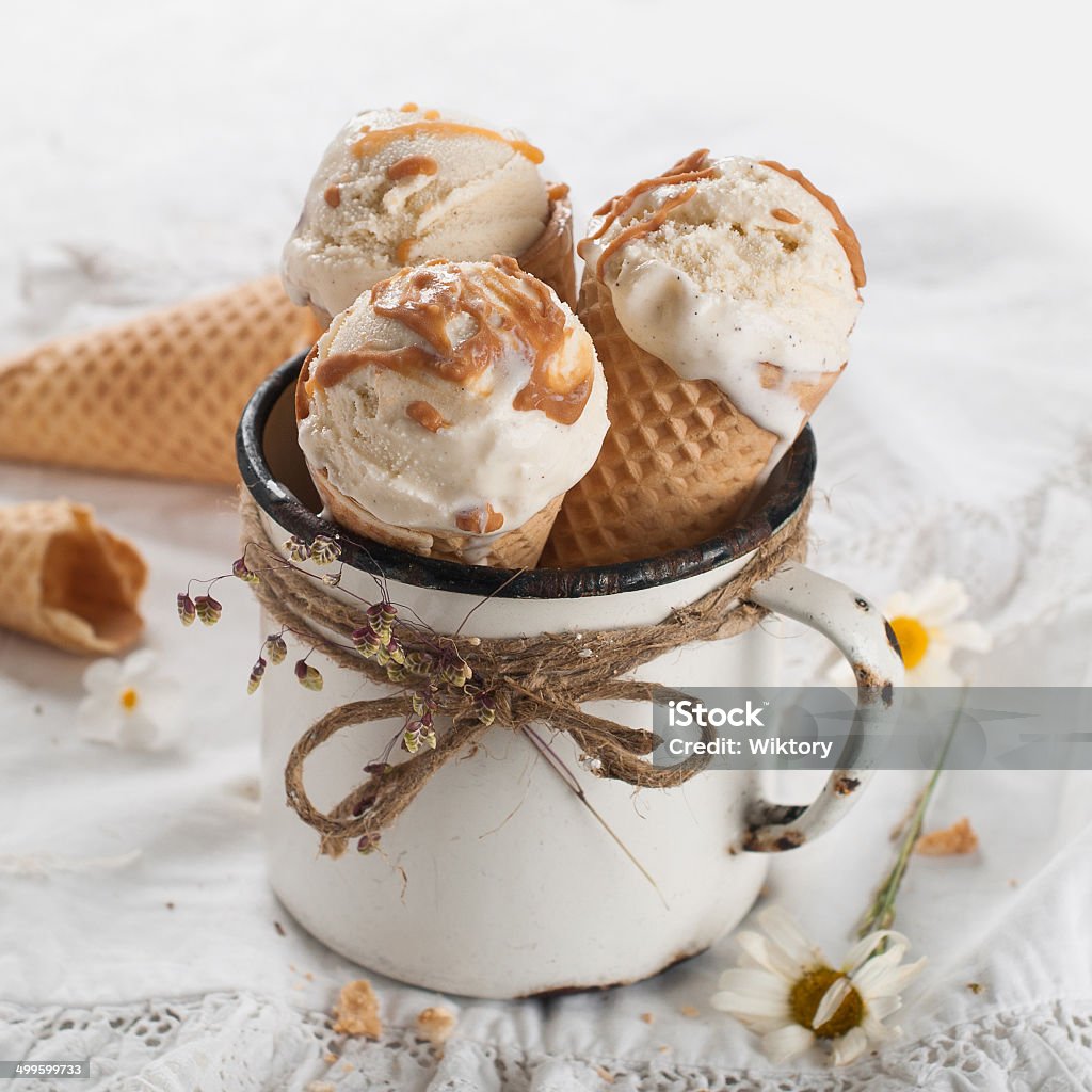 Ice cream Ice cream cones in an old vintage mug , selective focus Caramel Stock Photo