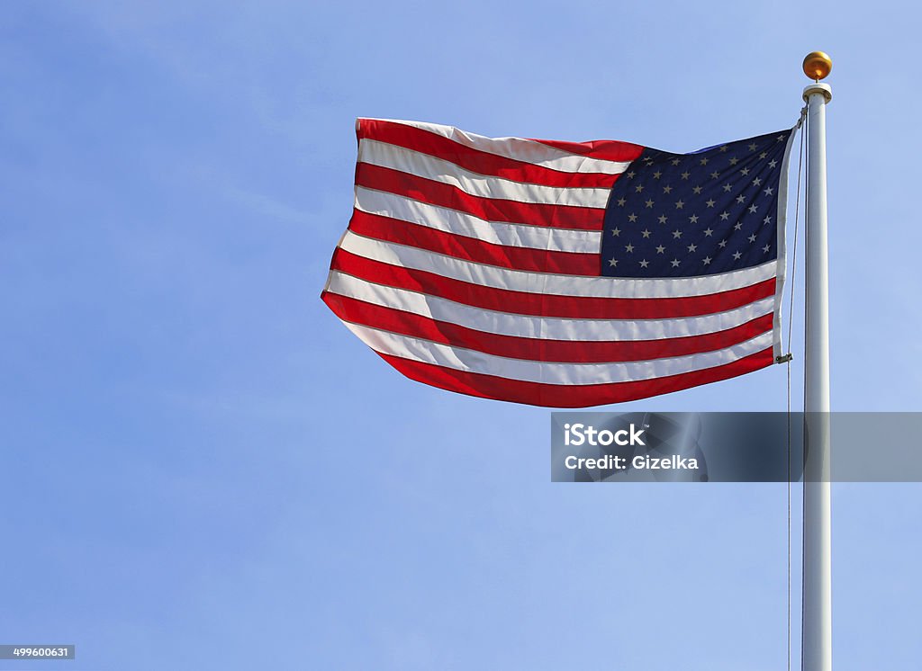 American Flag over Sky American Flag over Blue Sky American Culture Stock Photo