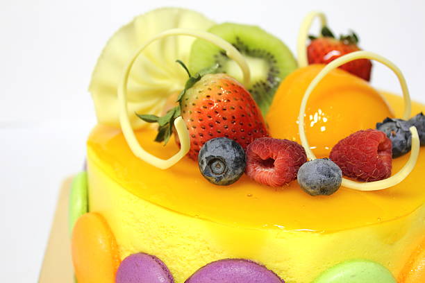 istock peach mousse cake and topped with fresh fruit. 499601359