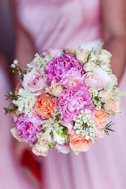 istock beautiful bride wedding bouquet holding in hands 499602097