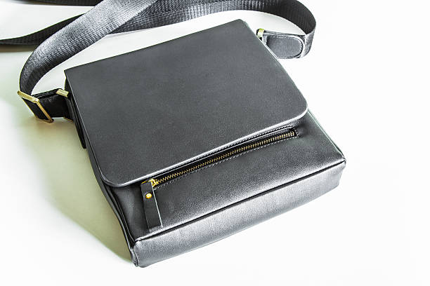 istock Men's leather bag on wood table 499602558