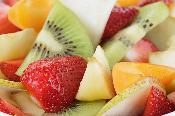 istock fresh mix fruit salad with strawberry, kiwi and peach 499603059