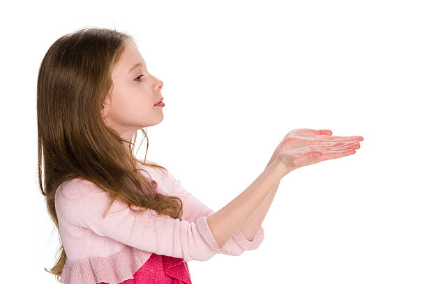 istock Young girl holds something in his hands 499603096