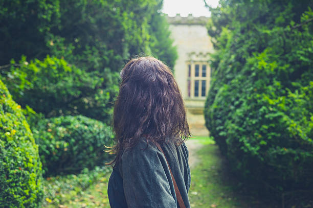 istock Young woman exploring formal garden 499603266