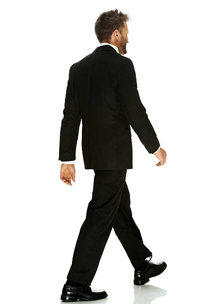 istock Rear view of businessman walking 499604083