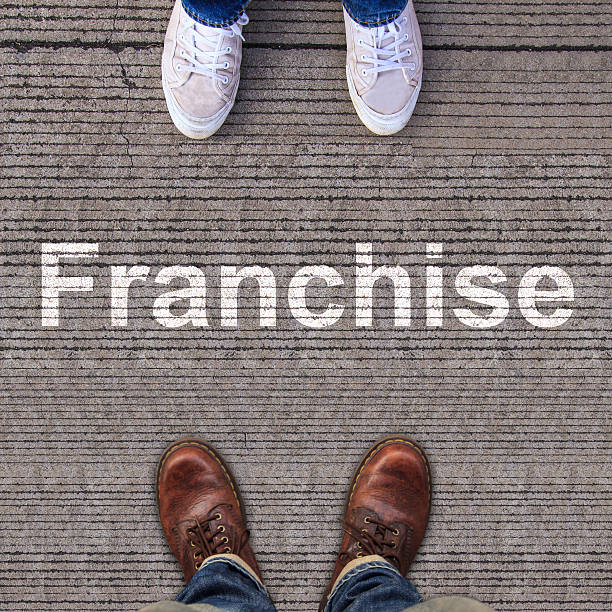istock Pair of shoes standing on walkway with arrow 499604097