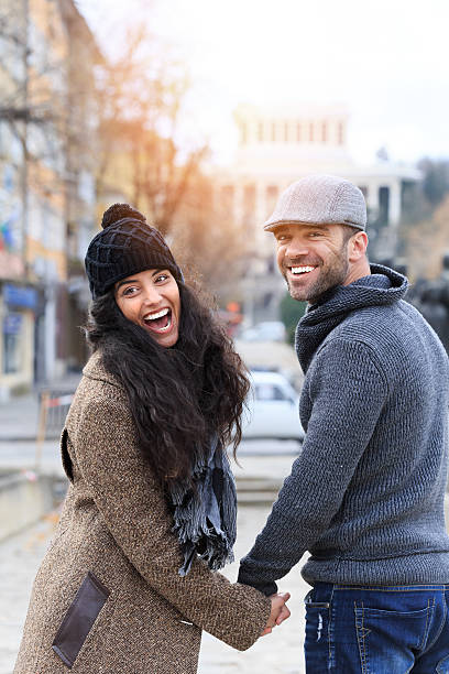 istock Young couple smiling holding hands 499604886