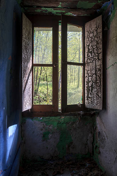 istock window of abandoned house 499607216