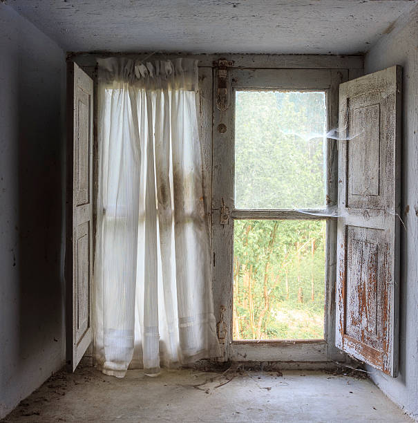 istock window of abandoned house 499607236