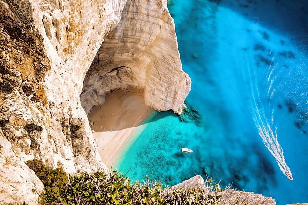 white luxury yacht against azure sea - idyllisk bildbanksfoton och bilder