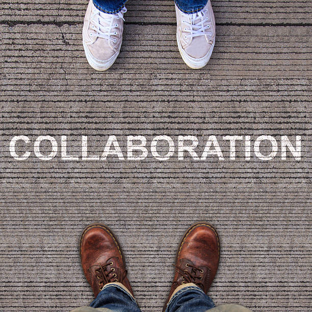 istock Pair of shoes standing on walkway with arrow 499617537