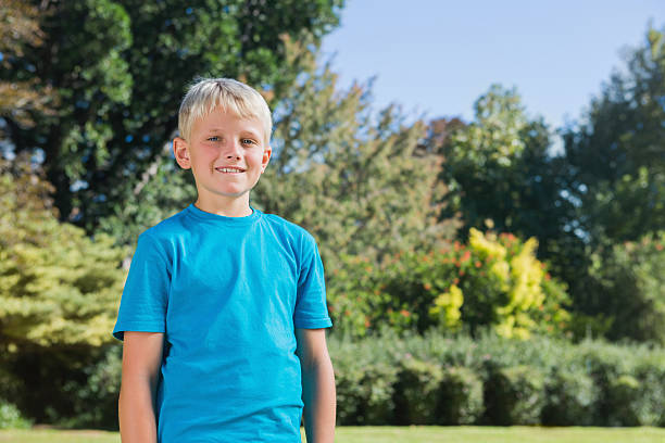 istock Young blonde boy smiling at camera 499617961
