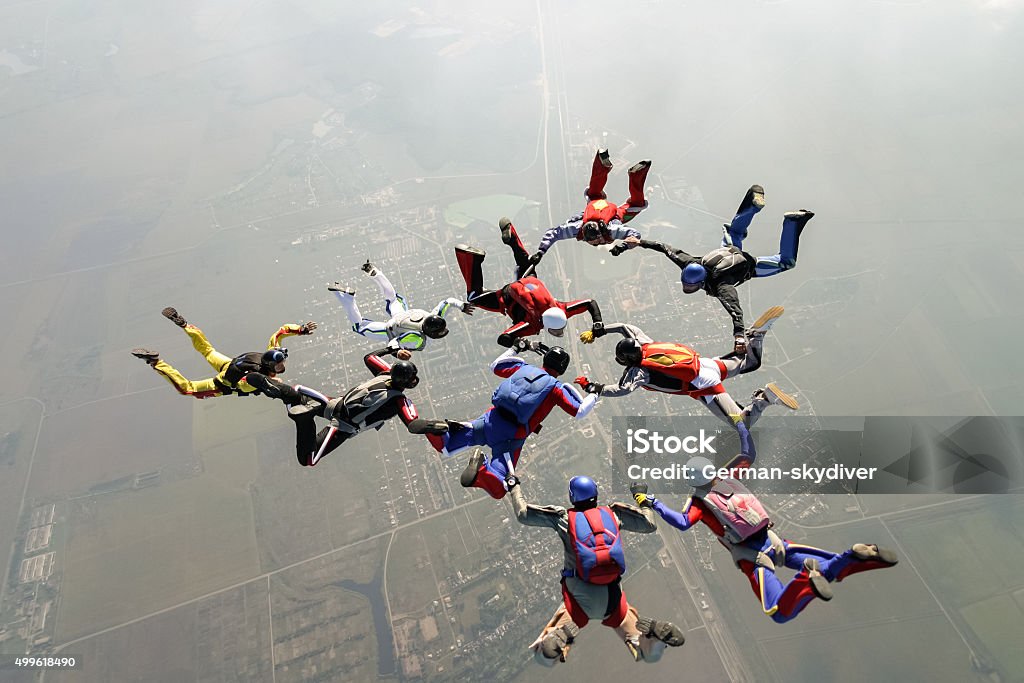 Skydiving photo. A group of paratroopers construct figures in free fall. Skydiving Stock Photo