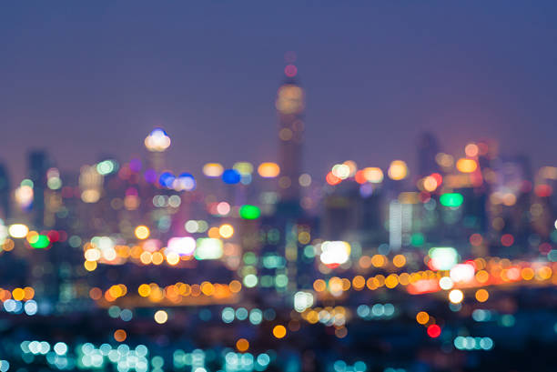 istock Blurred night downtown city, building background with light boke 499619326