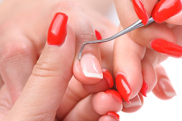 istock manicure applying - cleaning the cuticles 499619671